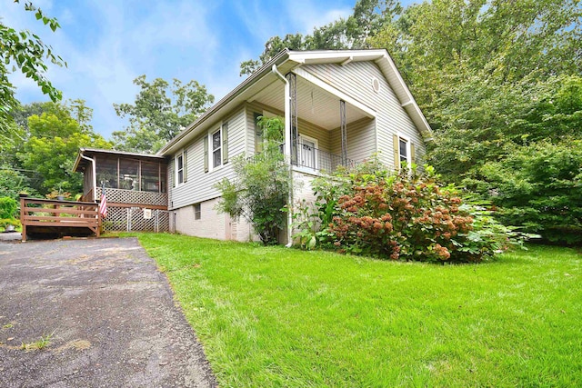 view of property exterior with a yard