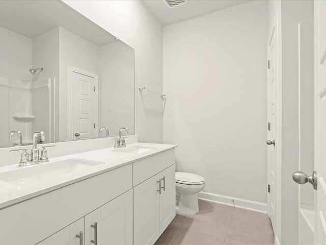 full bathroom featuring tile patterned flooring, baseboards, a sink, and toilet