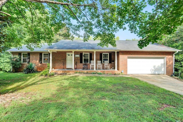 ranch-style home with a front lawn, a garage, and covered porch