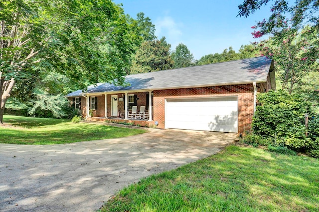 single story home featuring a garage, a front lawn, and a porch