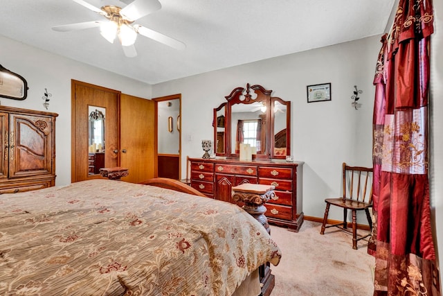 bedroom featuring ceiling fan and light carpet