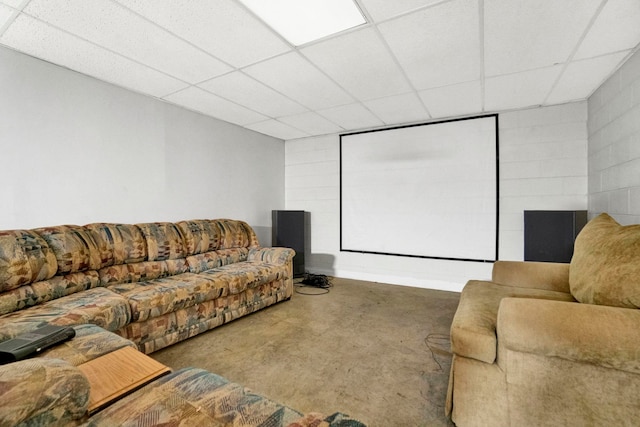 cinema room with carpet and a drop ceiling