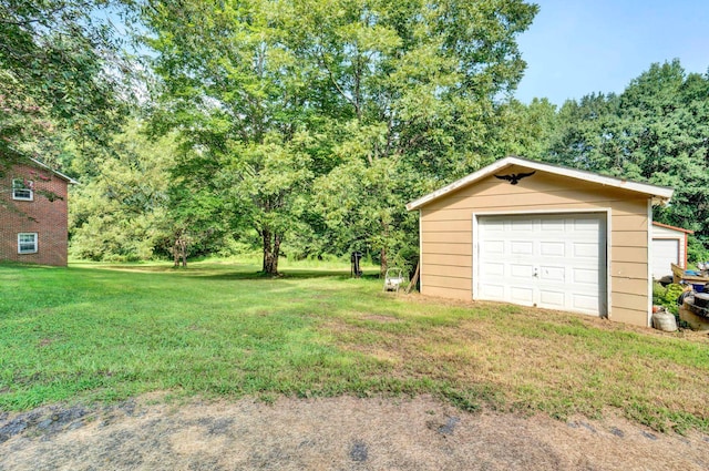 garage with a yard