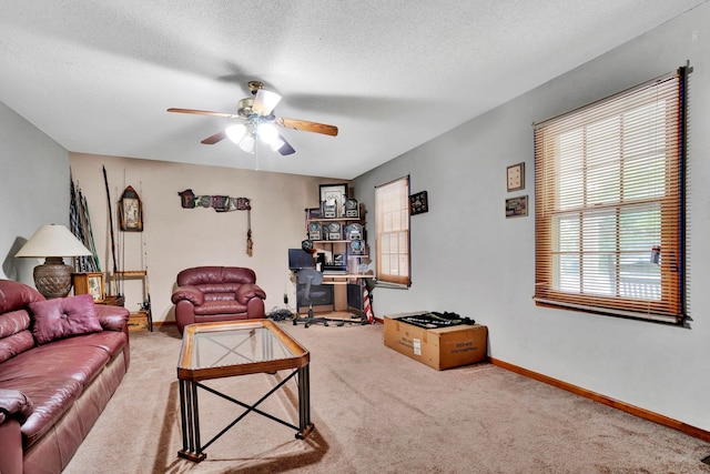 carpeted living room with ceiling fan and a textured ceiling