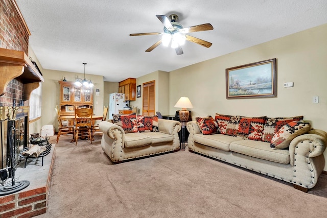 carpeted living room with a textured ceiling and ceiling fan with notable chandelier