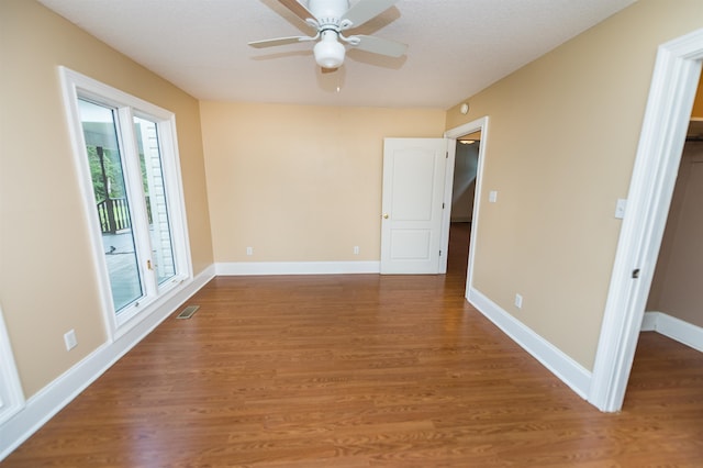 spare room featuring ceiling fan and wood-type flooring