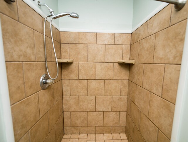 bathroom with tiled shower