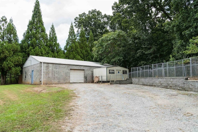 garage featuring a yard