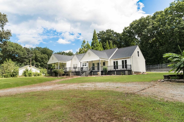 view of front facade with a front lawn and a porch