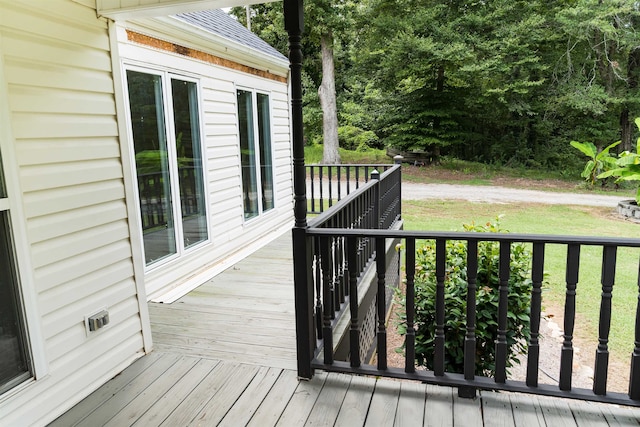 deck featuring a lawn