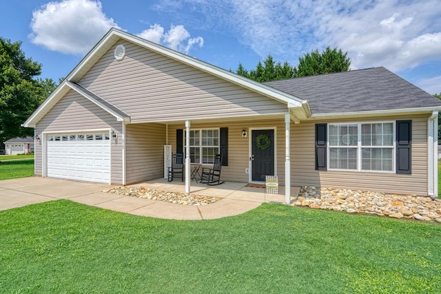 ranch-style house featuring a front lawn, a garage, and covered porch