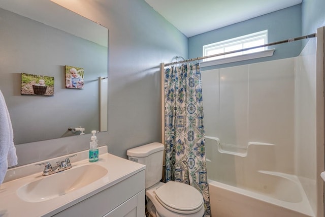 full bathroom featuring toilet, vanity, and shower / tub combo