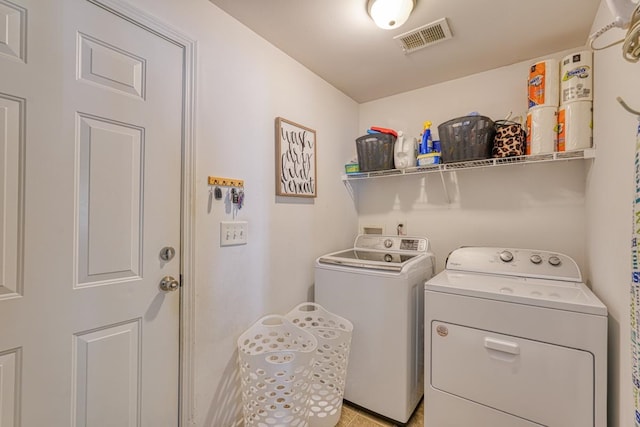 laundry room with washer and clothes dryer