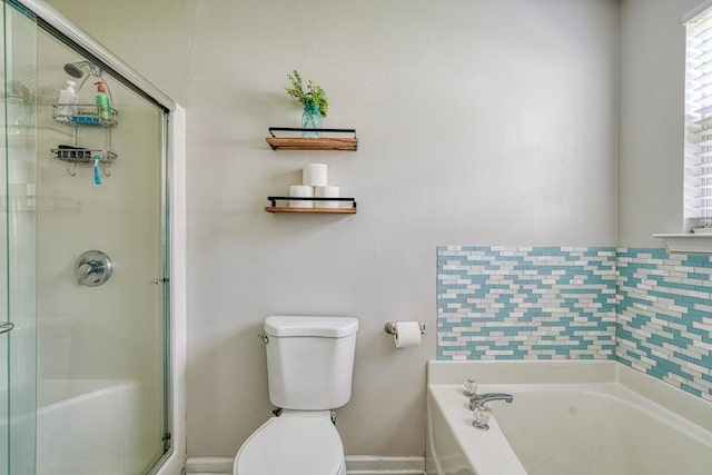 bathroom featuring toilet and separate shower and tub