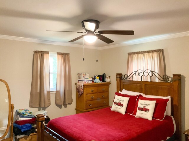 bedroom with ceiling fan and ornamental molding