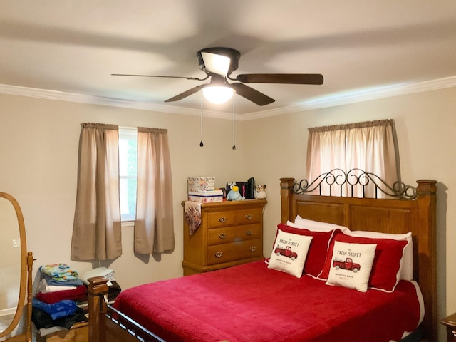 bedroom with ceiling fan and crown molding