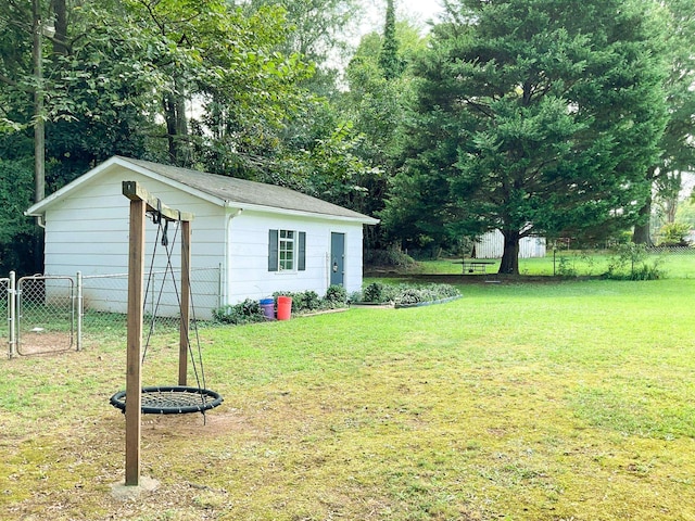 view of yard featuring an outdoor structure and fence