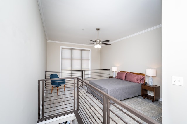 bedroom with ceiling fan and crown molding