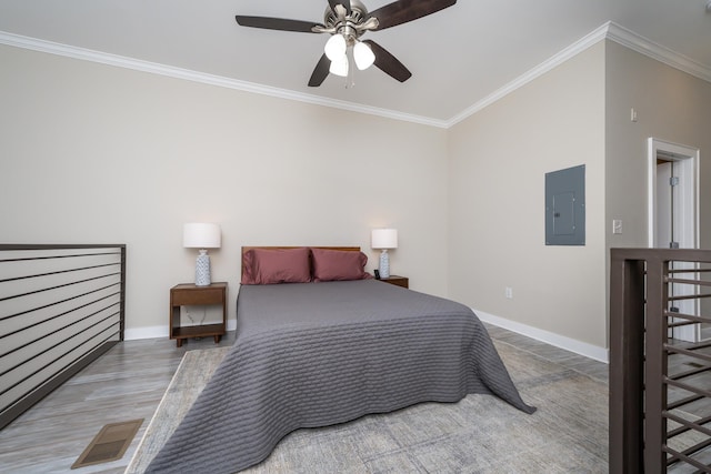 bedroom with ceiling fan, hardwood / wood-style flooring, electric panel, and ornamental molding