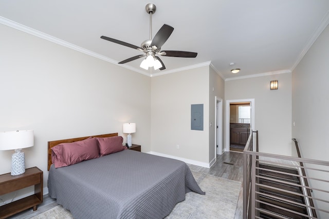 bedroom with light hardwood / wood-style flooring, electric panel, ornamental molding, ceiling fan, and ensuite bathroom