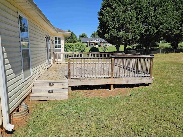 deck featuring a yard and fence