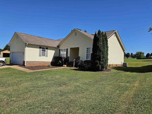 back of property with a garage, crawl space, a yard, central AC, and brick siding