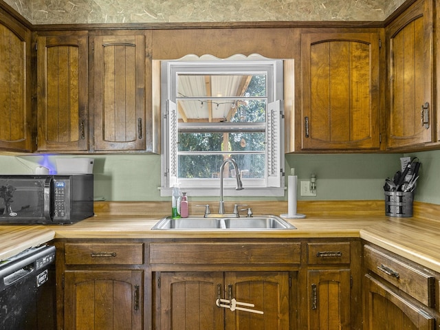 kitchen featuring sink and black appliances