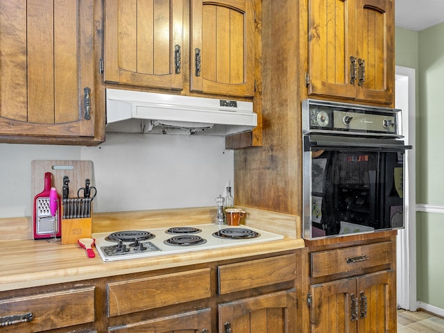 kitchen featuring oven and white gas stovetop