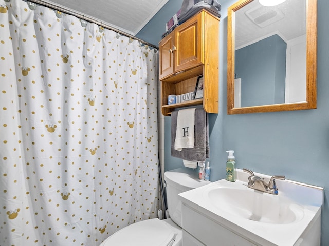 bathroom with ornamental molding, a textured ceiling, a shower with shower curtain, vanity, and toilet