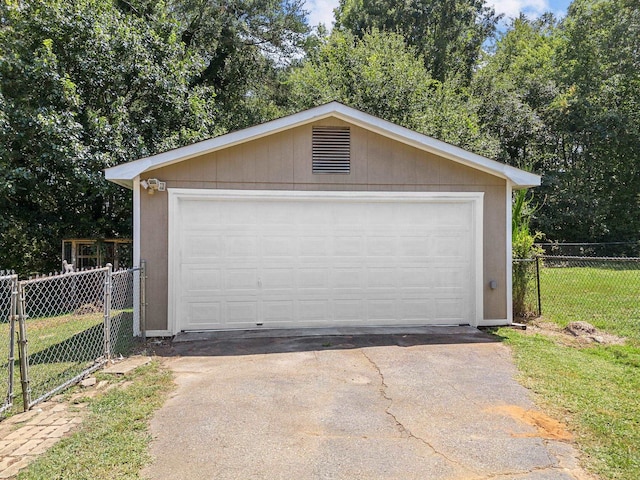 garage with a yard