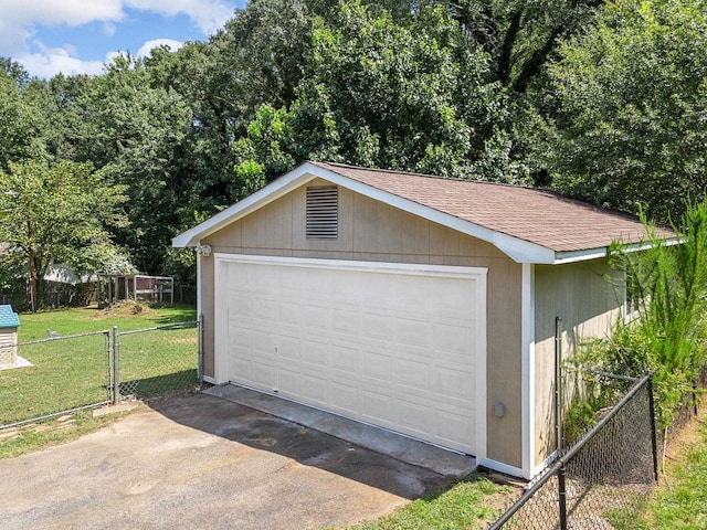 garage featuring a yard