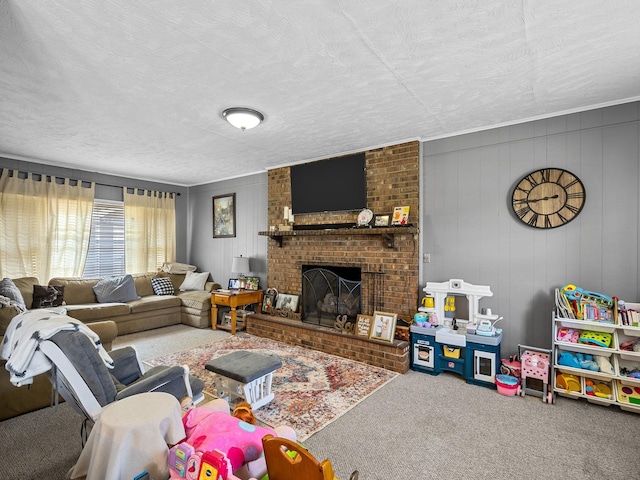 living room featuring a fireplace, carpet floors, brick wall, and a textured ceiling