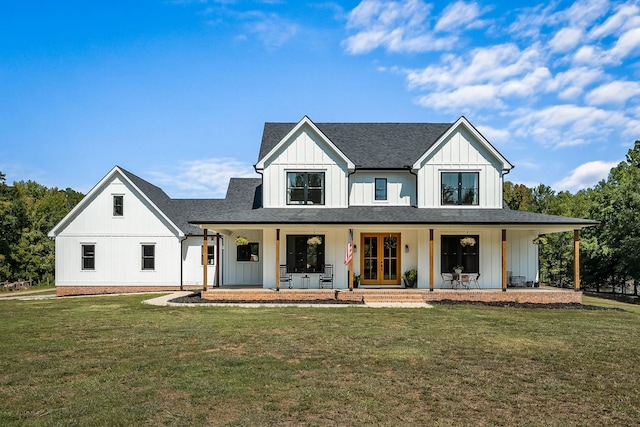 modern farmhouse featuring a shingled roof, french doors, a front lawn, a porch, and board and batten siding