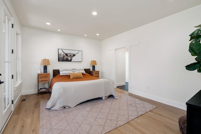 bedroom featuring recessed lighting, baseboards, visible vents, and light wood finished floors