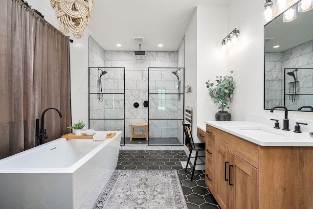 bathroom with recessed lighting, visible vents, vanity, tiled shower, and a soaking tub