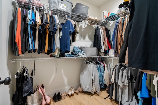 spacious closet with wood finished floors