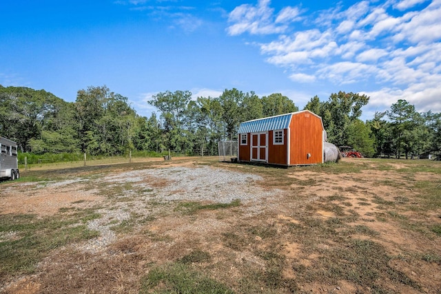 view of yard with a storage shed and an outdoor structure