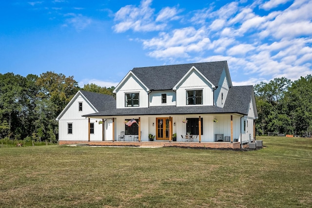 modern farmhouse style home with board and batten siding, roof with shingles, and a front lawn