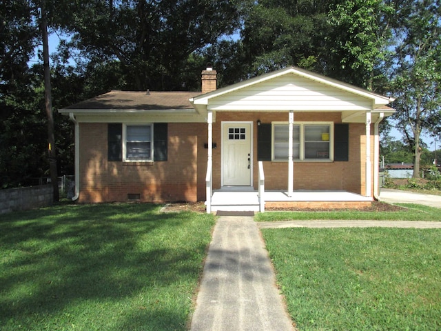 bungalow featuring a porch and a front lawn