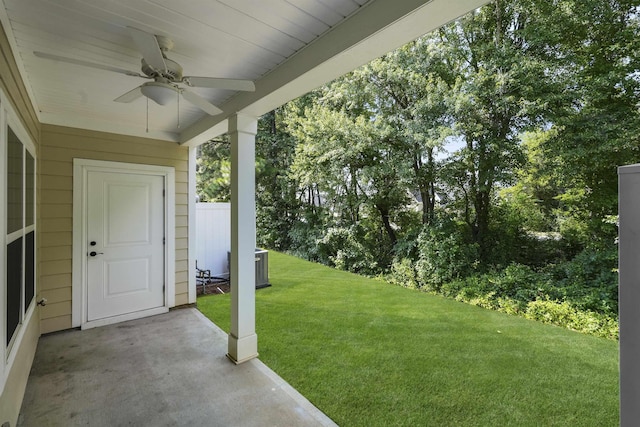 view of yard featuring ceiling fan, central AC unit, and a patio