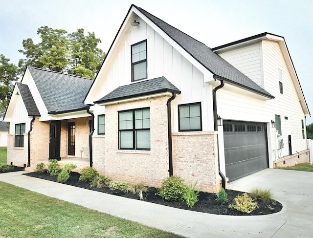 modern inspired farmhouse with a garage