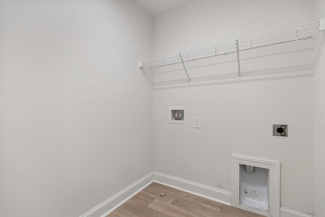 laundry area with washer hookup, hardwood / wood-style floors, and electric dryer hookup