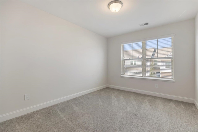 empty room featuring carpet flooring