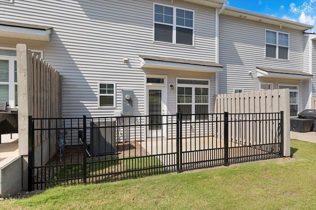 rear view of property with fence