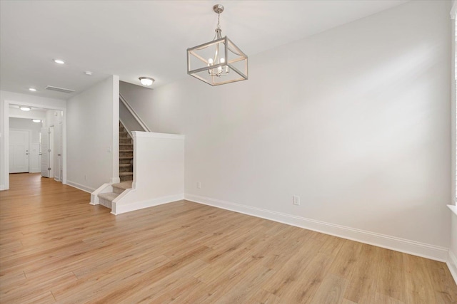 interior space with light wood-style floors, recessed lighting, stairway, and baseboards