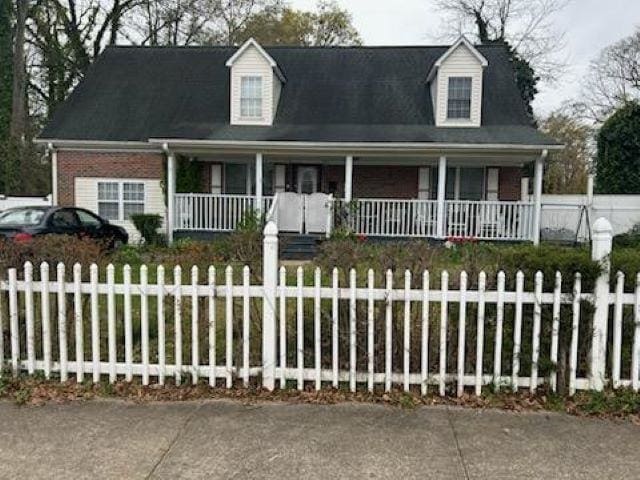 cape cod house with covered porch