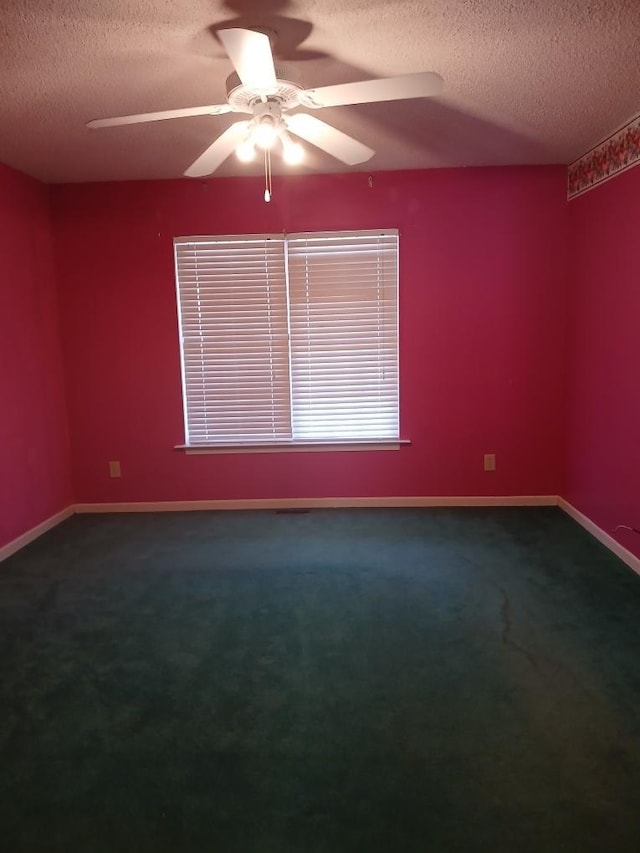 carpeted empty room with a textured ceiling and ceiling fan