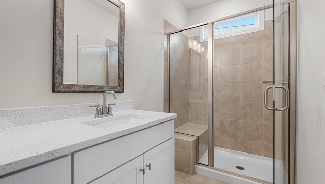 bathroom with vanity and an enclosed shower