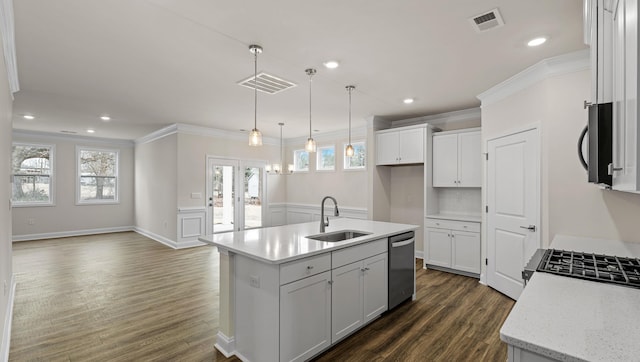 kitchen featuring dishwasher, sink, white cabinets, hanging light fixtures, and a kitchen island with sink