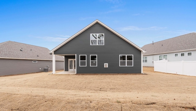 back of property with cooling unit and a patio